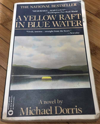 A yellow raft in blue water